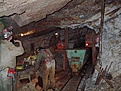 Mucking the white quartz ore into the ore cart.